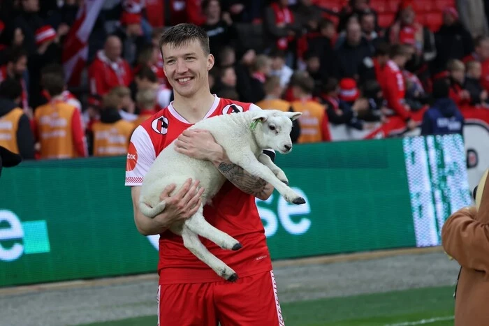 Football player with a lamb in a Norwegian club