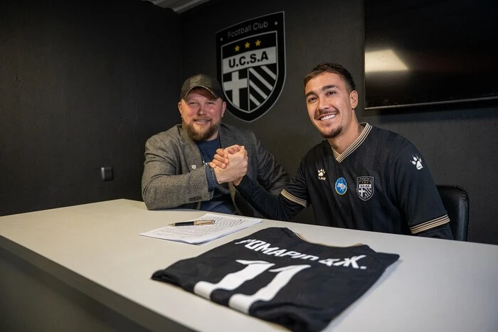 On the left in the photo, the football player is wearing the YUCASA team jersey.