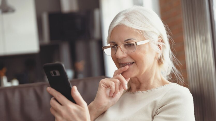 Elderly woman happy about pension increase in Ukraine